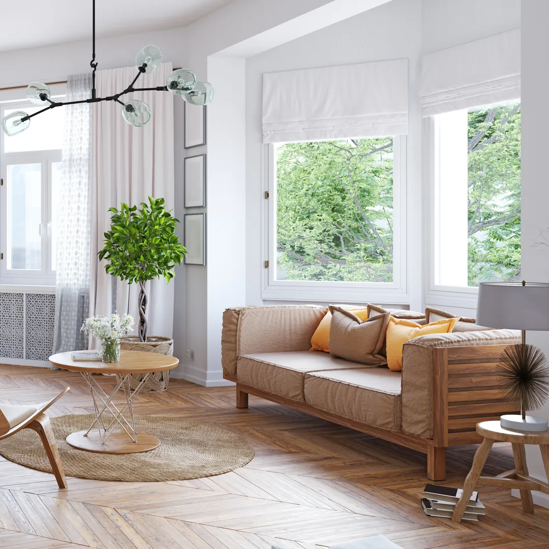 Bright living room with herringbone floors and natural greenery
